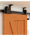Heavy Duty Barn Door Hardware Kit For Indoor Sliding Doors With Ceiling Rail System and T Shape Rollers installed on wood door