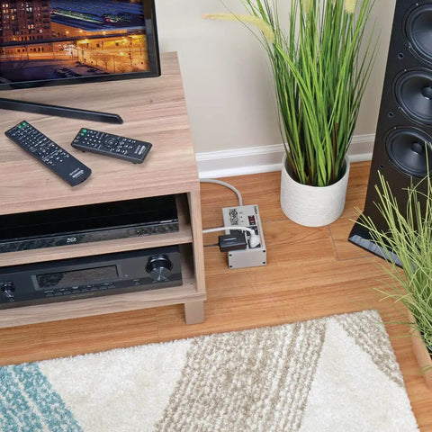 Beefy Four-Outlet Heavy Duty Power Strip With 3330 Joules Surge Protector under TV stand in living room setup