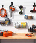 12 Pack Slatwall Organizer Kit with 4 wire baskets holding supplies and 8 heavy duty hooks for hanging tools in a garage setting