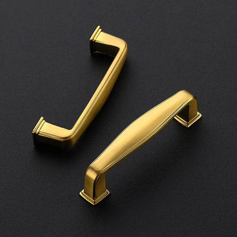 Top Shelf Gold Cabinet Handles And Bar Pulls For Kitchen Cupboards And Bathroom Drawers With Exact 3 Inch Center To Center Mounting heavy duty zinc alloy handles on a black background.