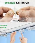 Hands holding a clear adhesive tab with the header 'Strong Adhesive' showcasing application for Sixty Clear Vertical Blind Repair Tabs Universal Snap In Replacement Clips.