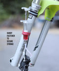 Pro Hydraulic Brake Bleed Kit For Shimano Brakes With 120ml Mineral Oil DIY Friendly At Home No Shop Fees Bleeding For Road Gravel And Mountain Bike Brakes Bicycle Maintenance Kit shown with syringe and fastener attached to fork