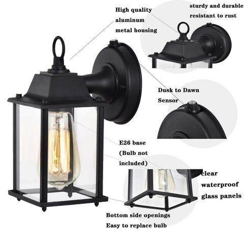 Close-up of 2 Pack Dusk To Dawn Outdoor Wall Mount Light Fixture with black finish, clear glass, and photocell sensor.