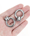 Heavy Duty 316 Stainless Steel Lifting Eye Nuts In One Quarter Inch Unc Thread shown in hand for industrial rigging tasks.