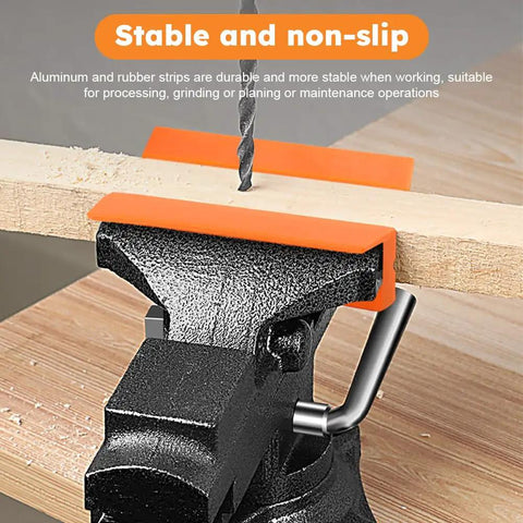 Set Of Two Pair Four Inch Soft Jaw Pads For Bench Vise With Knockout Magnetic Base offering stable aluminum and rubber grip on wood.