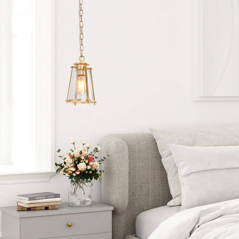 Gold Pendant Light Fixture For Kitchen Island And Dining Room with brass and bubble seeded glass over bedside table.