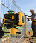 16 Line Laser Level Kit With 4D Self Leveling And Receiver Extends To 200ft For Indoor Layouts And Outdoor Fencing Decking Projects, High Precision Leveling Tool For DIY And Pros mounted on fence post during outdoor layout