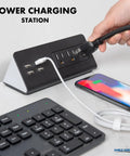 Slick Desk Clamp Power Strip With Four USB-A Ports And Three AC Outlets for easy charging, shown with a smartphone and keyboard.