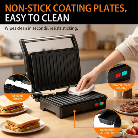 A person cleaning non-stick plates of a Stainless Steel 1000W Panini Press Grill And Sandwich Maker With Non Stick Plates Removable Drip Tray.
