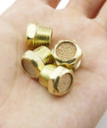 4 Pack Sintered Bronze Breather Vent One Quarter Inch NPT For Single Acting Cylinders Or Valves shown on a hand