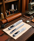 Pro Grade Leather Punch Set With Steel Hollow Punches, Three Piece Grommet Hole Punch Kit on leatherwork table