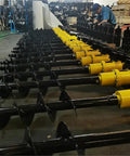 Hydraulic Earth Auger For Mini Excavator Backhoe Post Hole Digger Attachment lined up in a workshop for landscaping and construction projects