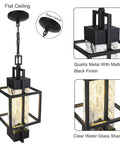 Top Tier 15 Inch Outdoor Indoor Pendant Light Featuring Heavy Duty Black Metal And Thick Water Seeded Glass Perfect For Front Porch Or Foyer Entryway Includes Dimmable Led Bulb No Hassle Install with matte black finish and clear water glass shade.