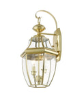 Monterey Two Light Outdoor Wall Lantern in Polished Brass Finish, clear beveled glass, side angle view