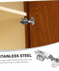 Set of 12 stainless steel cabinet hinges with mounting plates installed on a wooden kitchen cabinet door.