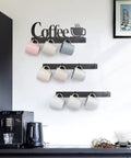 Coffee Mug Wall Rack With 12 Heavy Duty Hooks And Metal Sign For Coffee Bar Kitchen And Office Space Saving Wall Mounted Mug Organizer With Easy Access And Rustic Modern Style, displaying colorful mugs neatly above a black coffee station, showcasing a modern kitchen aesthetic.