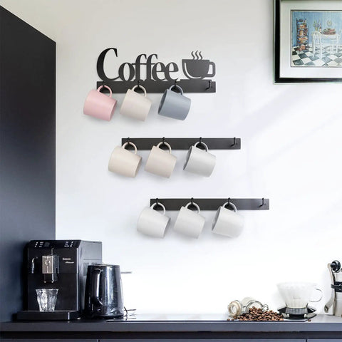 Coffee Mug Wall Rack With 12 Heavy Duty Hooks And Metal Sign For Coffee Bar Kitchen And Office Space Saving Wall Mounted Mug Organizer With Easy Access And Rustic Modern Style, displaying colorful mugs neatly above a black coffee station, showcasing a modern kitchen aesthetic.