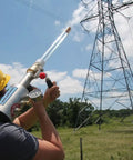 Line Thrower Kit For Arborists And Rescue Pros Pro Grade Air Powered Shoulder Shot Launcher in action near power lines