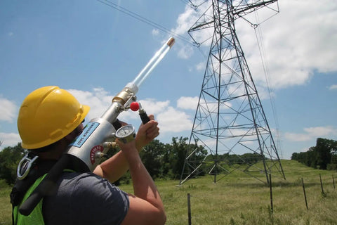 Line Thrower Kit For Arborists And Rescue Pros Pro Grade Air Powered Shoulder Shot Launcher in action near power lines