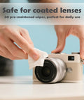 Streak-free lens cleaning wipe used on a camera lens; white wipe for camera cleaning.