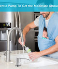 Brushed Nickel Kitchen Sink Soap Dispenser With A 47 Inch Silicone Extension Tube That Goes Directly To Your Large Dish Soap Bottle Say Goodbye To Constant Refills And Mess Easy Install Durable Countertop Pump in a modern kitchen setting.