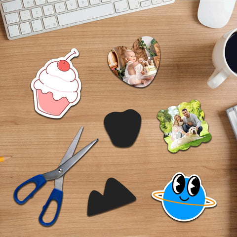 Table with flexible printable magnetic sheets for crafts, scissors, and various cut shapes. Non Adhesive Magnetic Sheets, Eight And A Half By Eleven Inches, Six Pack, Flexible Printable Magnetic Sheets For Crafts, Dies Storage, Fridge Magnets, DIY Projects, Awesome Classroom Use.