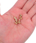 Solid 500 Pack Brass Knurled Threaded Inserts For M2 And M3 Metric Screws held in hand, showcasing detailed knurled design.