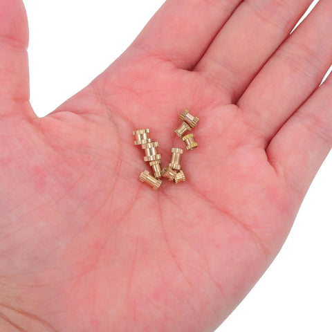 Huge 500 Pcs Brass Insert Nuts Assortment Kit Including M2 And M2.5 Knurled Fasteners shown in hand for heavy duty use.