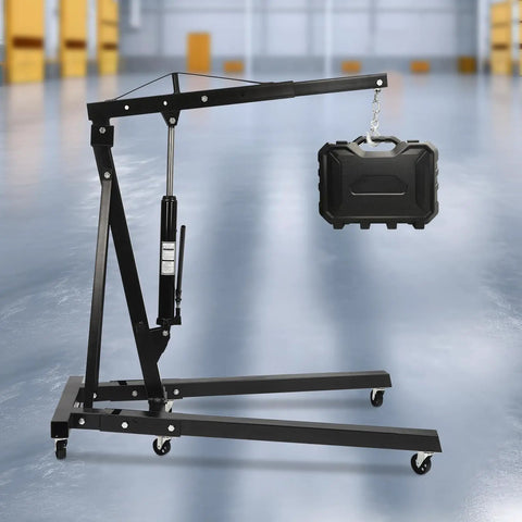 Smooth Operator Heavy Duty Hydraulic Engine Hoist Crane 2 Ton Shop Lift Rig with a weight, showing its sturdy design and wheels.
