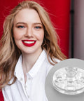 Smiling woman in white shirt with close-up of clear plastic sew-on snap button on the side