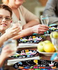 Kids using 96 Piece Science Party Tableware Set with 24 9 Inch Plates 24 7 Inch Plates 24 Napkins and 24 Forks in a party setting