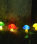 8 Pack Solar Mushroom Lights For Garden Decor With 8 Modes Waterproof Outdoor Mushroom Lamps glowing on lawn at night