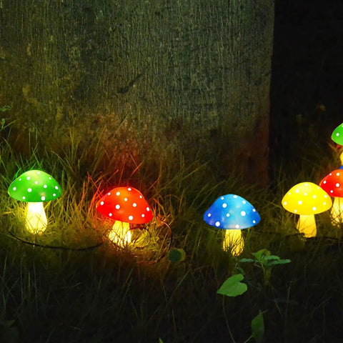 8 Pack Solar Mushroom Lights For Garden Decor With 8 Modes Waterproof Outdoor Mushroom Lamps glowing on lawn at night