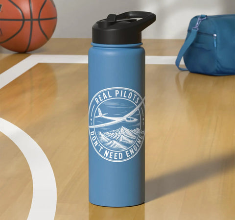 Sailplane Pilot Insulated Stainless Steel Water Bottle For Soaring Club Members And Glider Fans Keeps Drinks Cold Or Hot Through Towplane Launches And Final Glide Sessions All Day in blue with 'Real Pilots Don't Need Engines' design on basketball court.