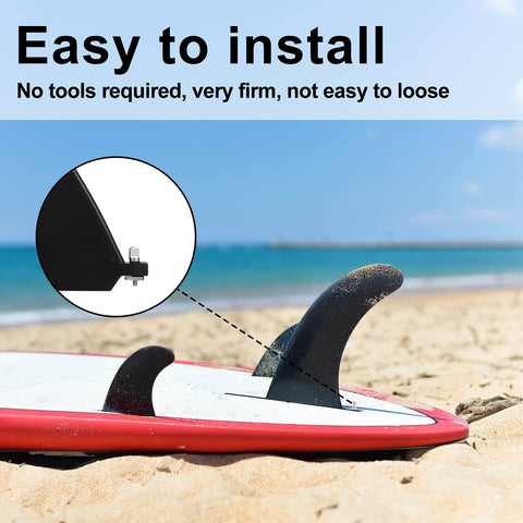 Close-up of a surfboard fin installed with 6 Piece No Tool Stainless Steel Thumb Fin Screws For Surfboard Longboard Paddleboard And SUP 316 Stainless Replacement Fin Hardware For Men And Women Easy Install Plug And Play Durable Corrosion Resistant Fin Screws on sandy beach.