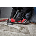 Heavy Duty 4 Inch Cordless Angle Grinder With Brushless Motor And M18 Battery Pack delivering killer torque during floor work.