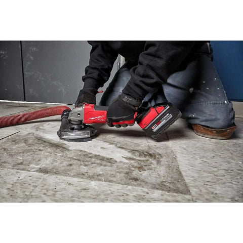 Heavy Duty 4 Inch Cordless Angle Grinder With Brushless Motor And M18 Battery Pack delivering killer torque during floor work.