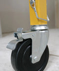 5 Inch Swivel Lock Caster For SRS 72 Steel Rolling Scaffold, Ball Bearing Wheel, attached to yellow scaffold leg indoors