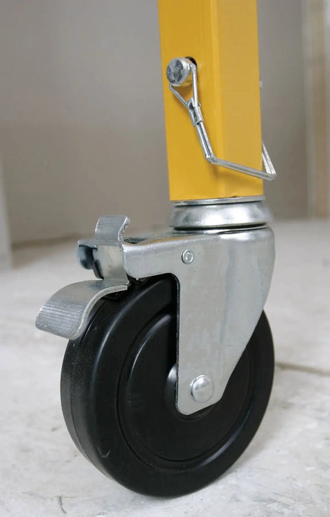 5 Inch Swivel Lock Caster For SRS 72 Steel Rolling Scaffold, Ball Bearing Wheel, attached to yellow scaffold leg indoors