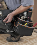 Tradesman Pro Electrician Padded Tool Belt And Pouch Set With Removable Pockets in use by electrician with drill and tools