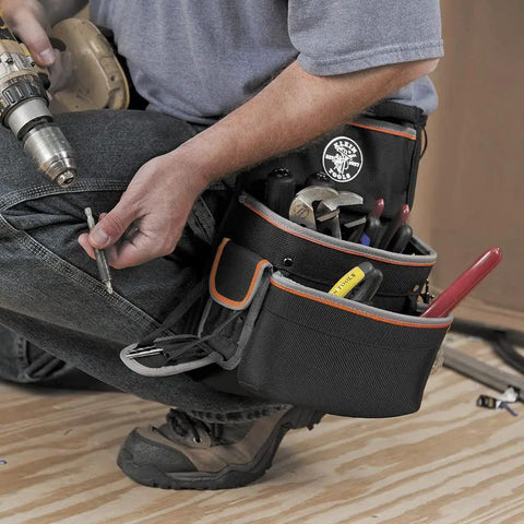 Tradesman Pro Electrician Padded Tool Belt And Pouch Set With Removable Pockets in use by electrician with drill and tools
