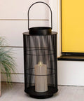 Outdoor Lantern With Realistic LED Candle For Patio, 12 Inch Black Metal Modern Farmhouse Style Lantern by door on porch
