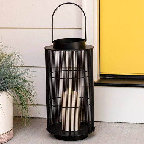 Outdoor Lantern With Realistic LED Candle For Patio, 12 Inch Black Metal Modern Farmhouse Style Lantern by door on porch