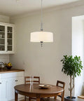 Modern kitchen with round table and pendant light above