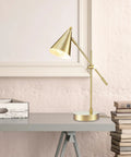 Dope Mid Century Modern 18 Inch Desk Lamp With Matte Brass Finish Adjustable Height Balance Arm Rotary Switch On Shade For Bedroom Or Office E26 Base 50W Bulb Durable Task Light For Home Office on a stylish desk with books and a decorative box