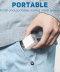 Person placing 5V 2A USB Wall Charger For Sonicare Electric Toothbrushes And Water Flossers into pocket, white adapter.