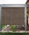 Outdoor Cordless Roller Sun Shade 6 Foot Wide By 8 Foot High Mocha installed on a patio providing privacy and UV protection.