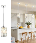 etiruety Adjustable Modern Crystal Chrome Pendant Lights Kitchen Island hanging over a kitchen island with three light fixtures.