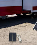 2W 6V Monocrystalline Solar Panel Charger With USB Output for outdoor lighting, placed near trailer with visible USB cable