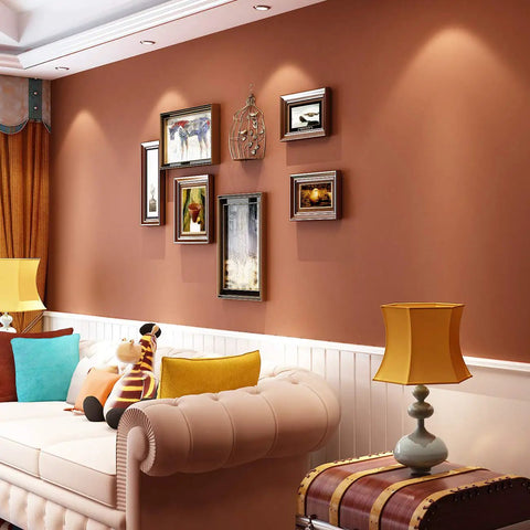 Living room with matte brown peel and stick contact paper removable wallpaper self adhesive vinyl waterproof on wall behind sofa.